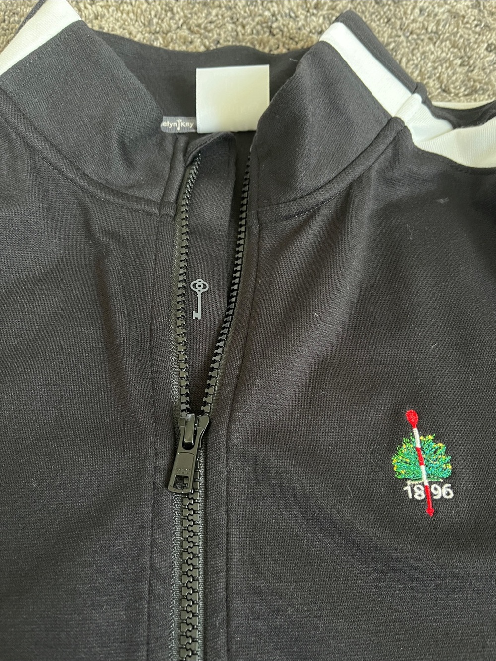 Merion Golf Club. Ladies Belyn Key Black Jacket w/White Shoulder Stripes. New LG